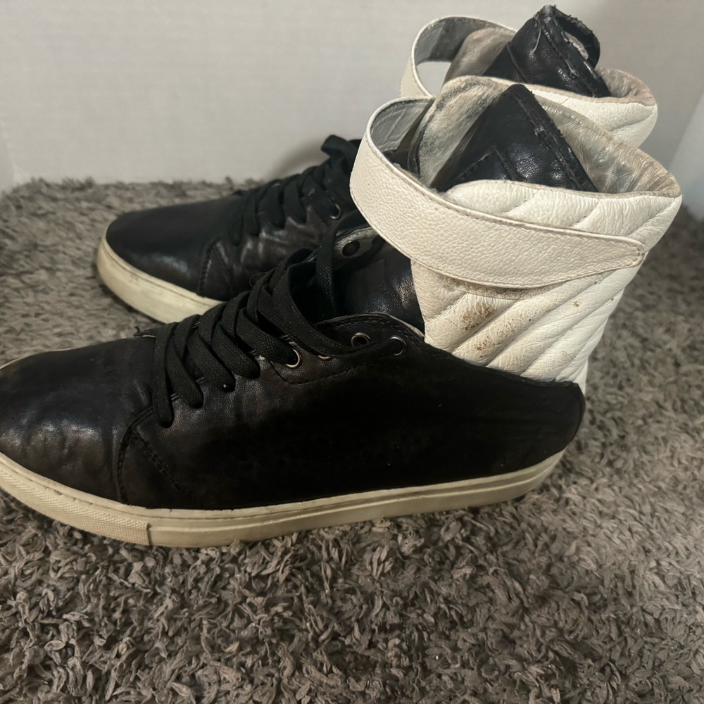 Red and black pair of Android Homme High tops